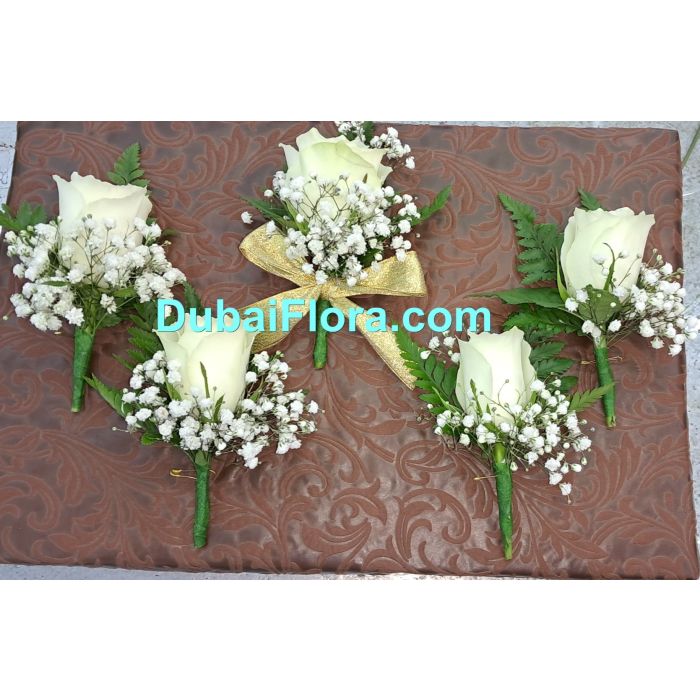 Boutonnieres with white rose and Gypsophilia
