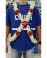 baddi with tuberoses and red baby roses 